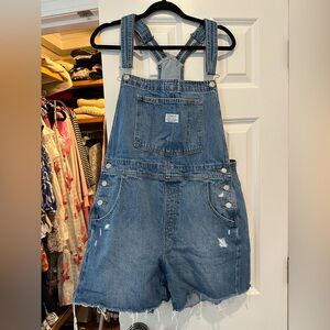 Levi’s Denim overall shorts with Distressed Details